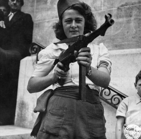 -Nicole-_a_French_Partisan_Who_Captured_25_Nazis_in_the_Chartres_Area,_in_Addition_to_Liquidating_Others,_Poses_with..._-_NARA_-_5957431_-_cropped