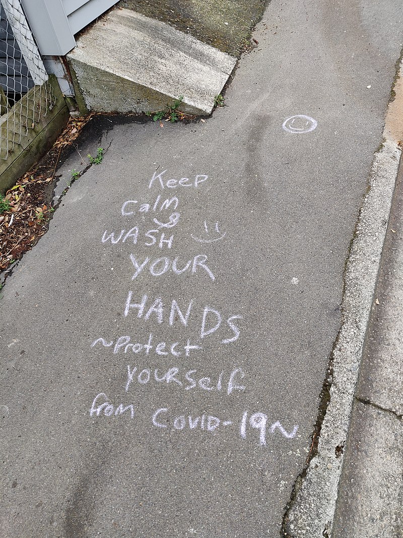 800px-COVID_Message_in_chalk_on_pavement